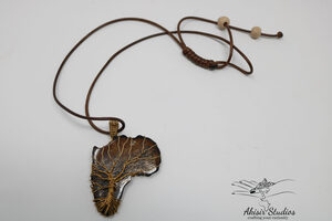 Ethical Tree Of Life On Brown Cowbone Pendant.